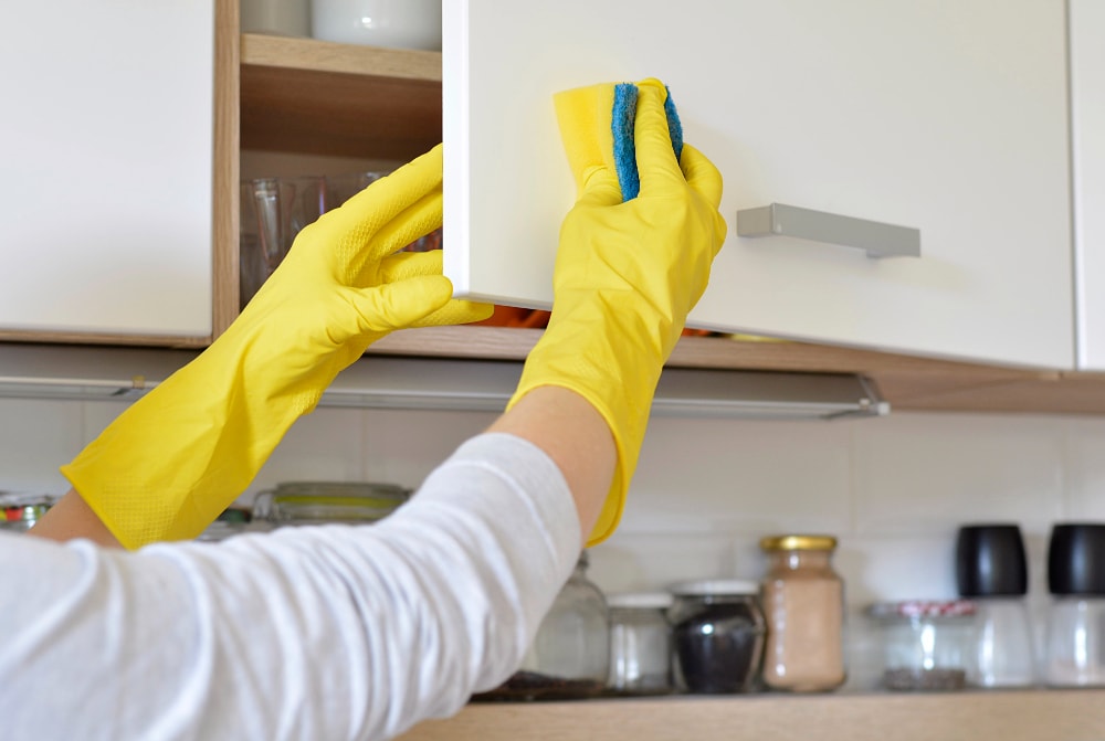 why do kitchen cabinets get sticky